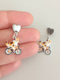 Pendientes Gata en bicicleta