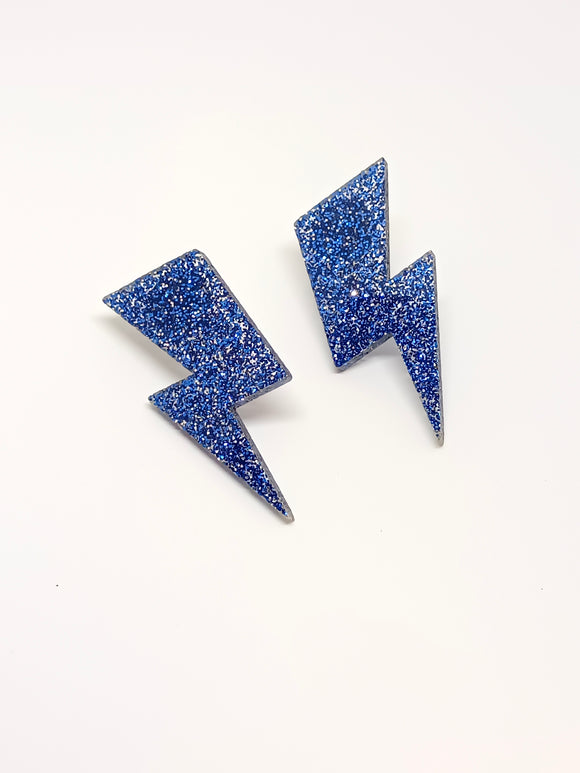 Rays g earrings. blue glitter
