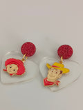 Pendientes Personajes juguetes y corazones transparentes
