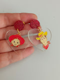 Pendientes Personajes juguetes y corazones transparentes