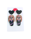 Pendientes Kokeshi Bruja Avería y corazones