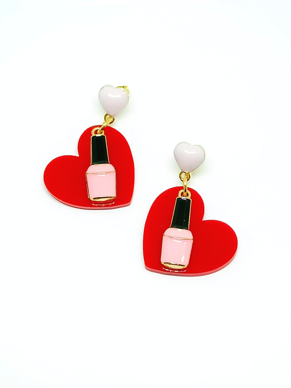 Heart earrings and nail polish